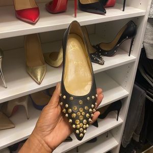 Christian Louboutin flats with gold spikes